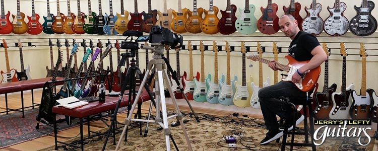 Shane Diiorio shooting videos of left hand guitars at Jerry's Lefty Guitars